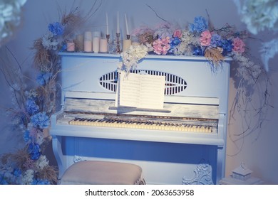 Decorations with flowers and blue retro piano