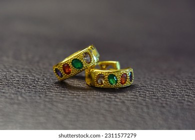 decorations It's a gold earring decorated with gems. - Shutterstock ID 2311577279