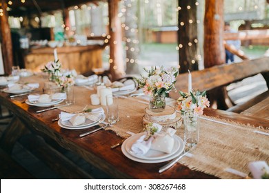 decorations made of wood and wildflowers served on the festive table