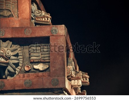Decorations on the front facade of the Pyramid of the Feathered Serpent, showing ancient gods heads.