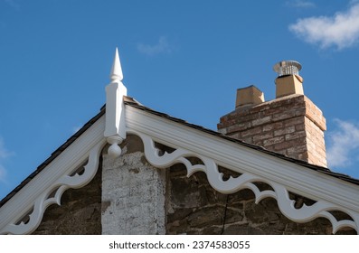 Decorative Accoya Wood Barge Boards and Finial in traditional roofing application