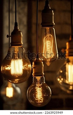 Decorative antique Edison style filament light bulbs glowing in the dark
