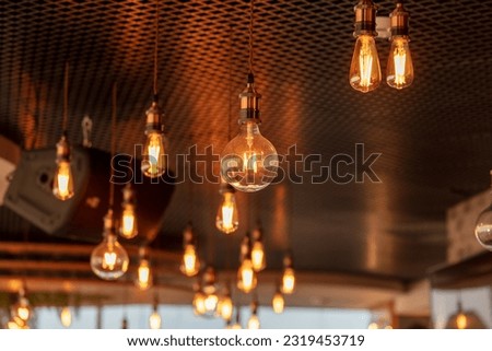 Decorative antique edison style filament light bulbs hanging from ceiling.