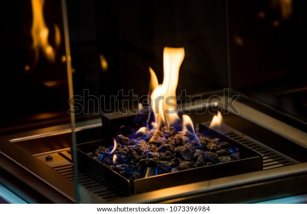 Decorative Artificial Fireplace White Stones Room Stock Photo