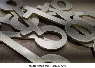 Decorative brass keys are carved on a CNC water jet cutting machine. - Powered by Shutterstock