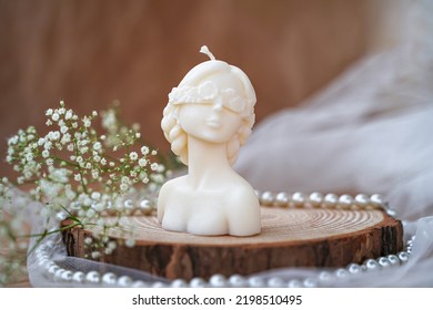Decorative candle in form of woman bust. Soy candle handmade. Concept of femininity - Shutterstock ID 2198510495