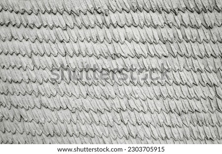 Decorative cement wall with leaves shape pattern. Background and texture.