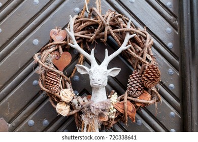 Decorative Christmas Season Wrath With A Deer On A Brown Door