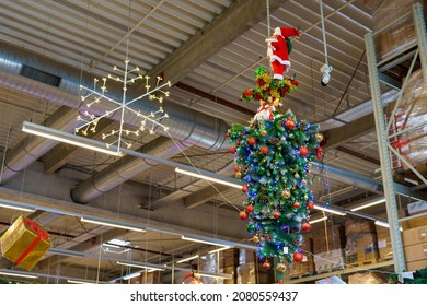 Decorative Christmas tree upside down in a store. Decor for the New Year. Background with copy space for text. Illustrative editorial. December 18, 2021 Balti Moldova.