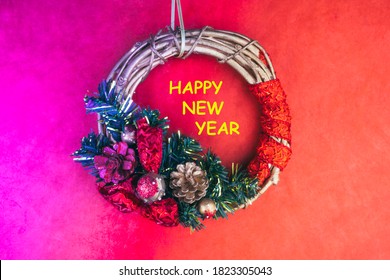 Decorative Christmas wreath on the creative toned in neon background, cones, ribbon, branch. Copy space. Greeting card - Powered by Shutterstock