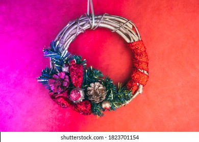 Decorative Christmas wreath on the creative toned in neon background, cones, ribbon, branch. Copy space. Greeting card - Powered by Shutterstock