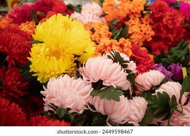  Decorative colorful Floral wall background.  various colorful plastic flower  - Powered by Shutterstock
