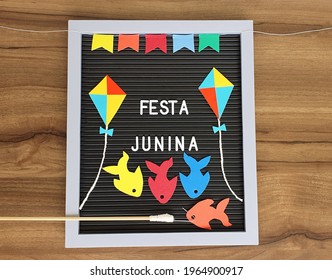Decorative And Colorful Frame With Flags, Kites And Toy Fishing, To Celebrate The Brazilian June Party With Written Text Festa Junina In Portuguese.