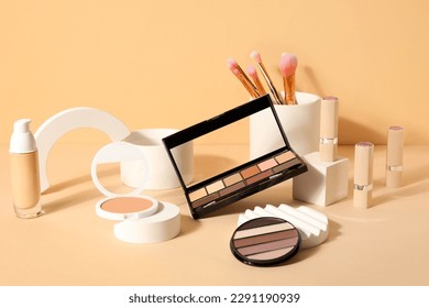 Decorative cosmetics with brushes and podiums on beige background - Powered by Shutterstock - Get 15% off with code: PIKWIZARD15