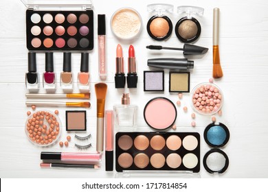 Decorative cosmetics and makeup brushes on a white background, top view - Shutterstock ID 1717814854