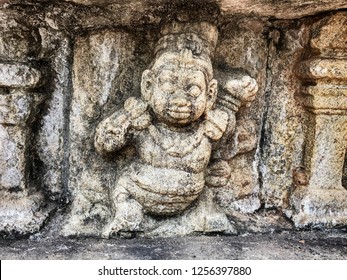 A Decorative Detail On The Vatadage Dagoba Shrine In The Ancient City Of Polonnaruwa In Sri Lanka Shows A Chubby Little Man Dancing.