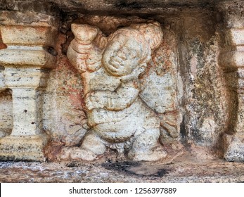 A Decorative Detail On The Vatadage Dagoba Shrine In The Ancient City Of Polonnaruwa In Sri Lanka Shows A Chubby Little Man Dancing With A Disco Move.