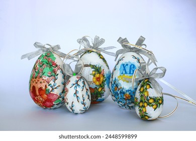 Decorative Easter eggs on a white background. Greeting inscription Christ Rises 