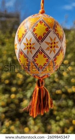 Decorative Easter eggs showcase stunning Ukrainian pysanka designs, adorned with intricate patterns and bright colors.