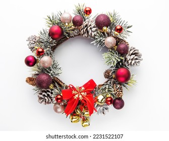 Decorative festive Christmas wreath. Wreath with red and golden christmas toys on white background - Powered by Shutterstock