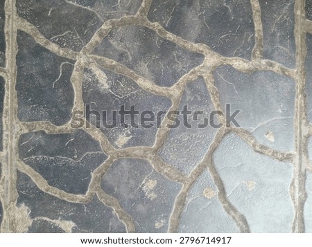 decorative flagstone tile texture with irregular stone pattern and concrete groud lines. natural grey stone floor surface with weathered texture. suitable for background. architectural design. 3D rendering. and seamless tile material.