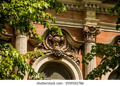 decorative fretwork elements and  Corinthian order columns at the 19th-century building