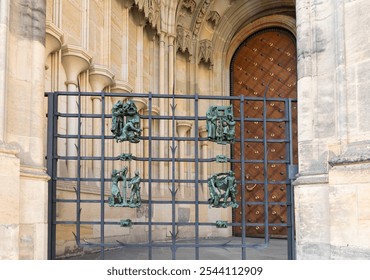 Decorative iron gate near the side entrance to the St Vitus Cathedral near the New Royal Palace in Prague in Czech Republic - Powered by Shutterstock