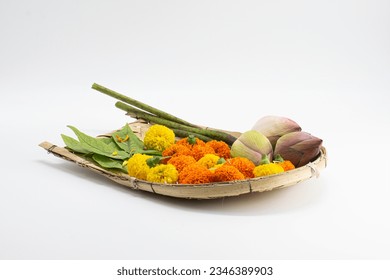 DECORATIVE KULO WITH LOTUS, MARIGOLD FLOWER ISOLATED ON WHITE BACKGROUND WITH SELECTIVE FOCUS. 