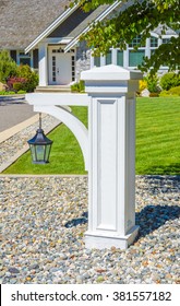 Decorative Lamp Post In Front Of A House Entrance. Vertical.