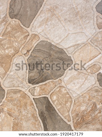 Decorative light masonry stonework wall texture, background of different sizes stones