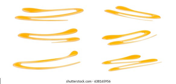 Decorative lines of honey isolated on white background