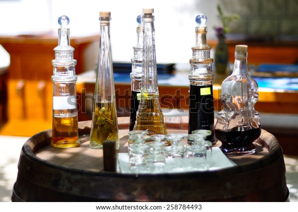 Decorative Liquor Bottles On Wooden Barrel Stock Photo Edit Now