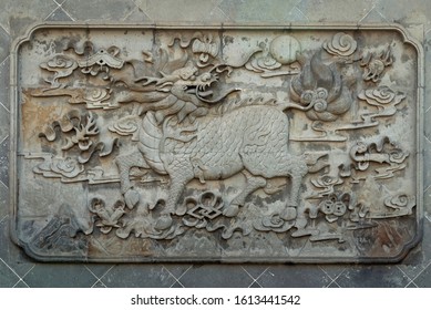 Decorative Motif In Relief Of Stone Kylin (Qilin) Statue In City God Temple Of Shanghai, China. A Mythical Hooved Chimerical Creature Known In Chinese And Other East Asian Cultures