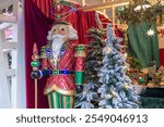 Decorative multicolored figurine of a fairy-tale character and a Christmas tree. Festive decorations in Moscow near the Red Square. Christmas holidays and a good mood on New Year