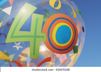 Decorative Mylar Balloon With The Number Forty On It. Blue Sky In The Background.