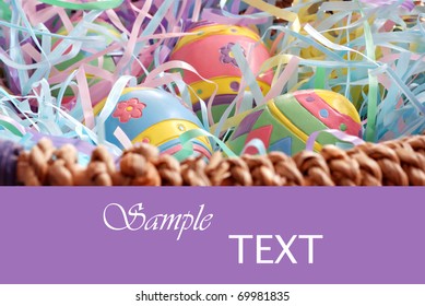 Decorative painted easter eggs in basket on purple background with copy space.  Macro with extremely shallow dof.