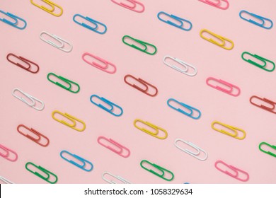 Decorative Paper Clips Pattern On Pastel Pink Background Minimal Creative Concept.