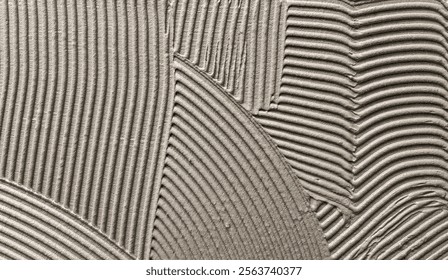 Decorative plaster is creating a wavy pattern, perfect for backgrounds and textures