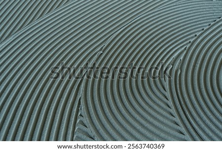 Decorative plaster is creating a wavy pattern, perfect for backgrounds and textures