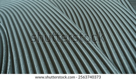 Decorative plaster is creating a wavy pattern, perfect for backgrounds and textures