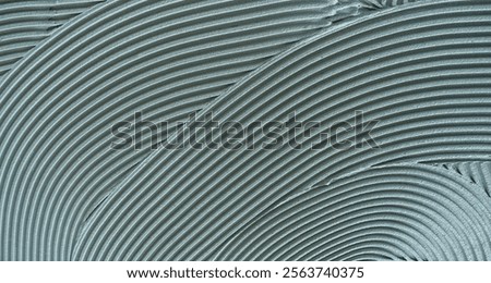 Decorative plaster is creating a wavy pattern, perfect for backgrounds and textures