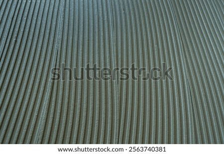 Decorative plaster is creating a wavy pattern, perfect for backgrounds and textures