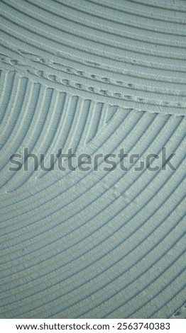 Decorative plaster is creating a wavy pattern, perfect for backgrounds and textures