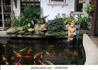 Decorative Pond With Gold Fish In Luxury Garden Home