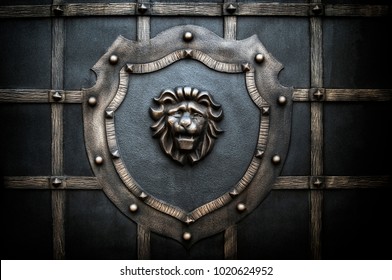 decorative processing of a metal fence in the form of a lion on a shield