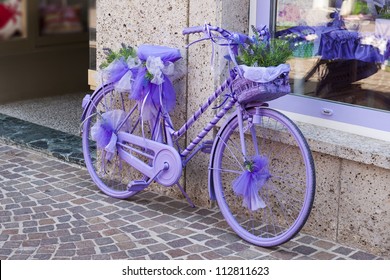 purple bicycle with basket