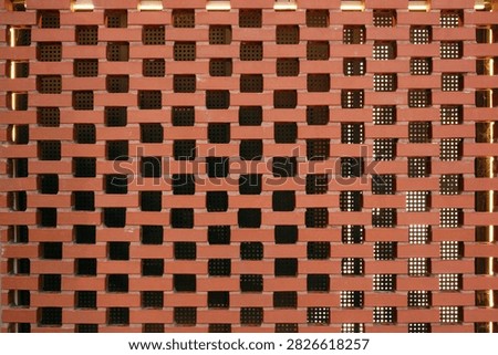 Decorative Red Brick Wall With Repeating Geometric Openwork Pattern