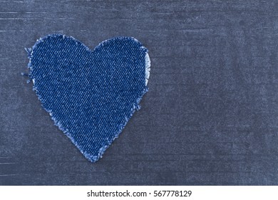 Decorative Ripped Denim  Heart  On Grey Background. Destroyed Torn Denim Blue Jeans Patch, Fashion Background