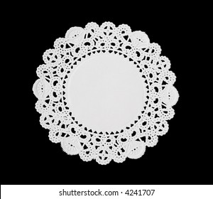 A Decorative Round Doily Isolated Over Black