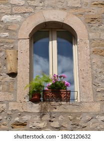 Decorative rustic window with flower pots in the old town of Split Croatia